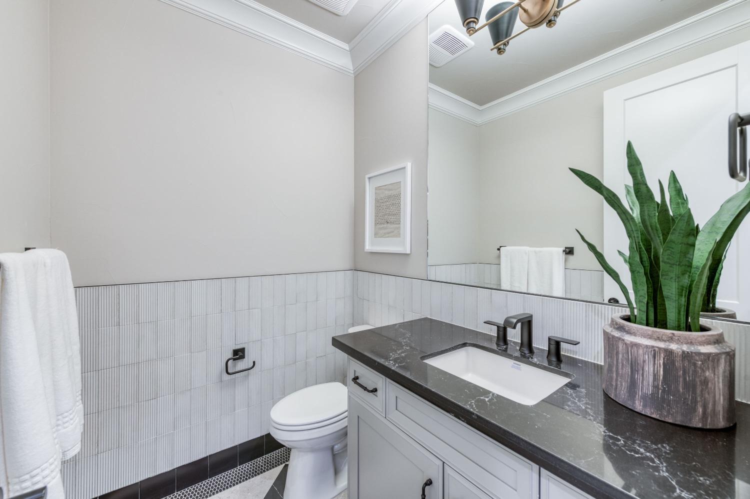 881 Terrace Place Madera, CA 93636 - Photo 29 of 85 a bathroom with a granite countertop sink and a mirror