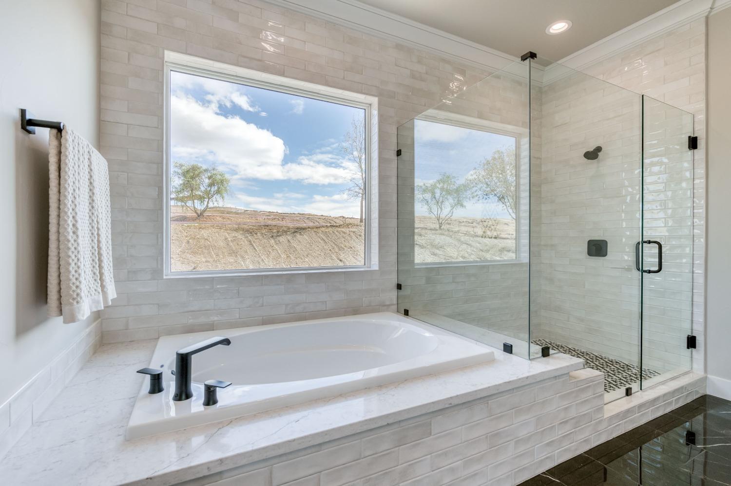 881 Terrace Place Madera, CA 93636 - Photo 44 of 85 a bathroom with a tub and a sink