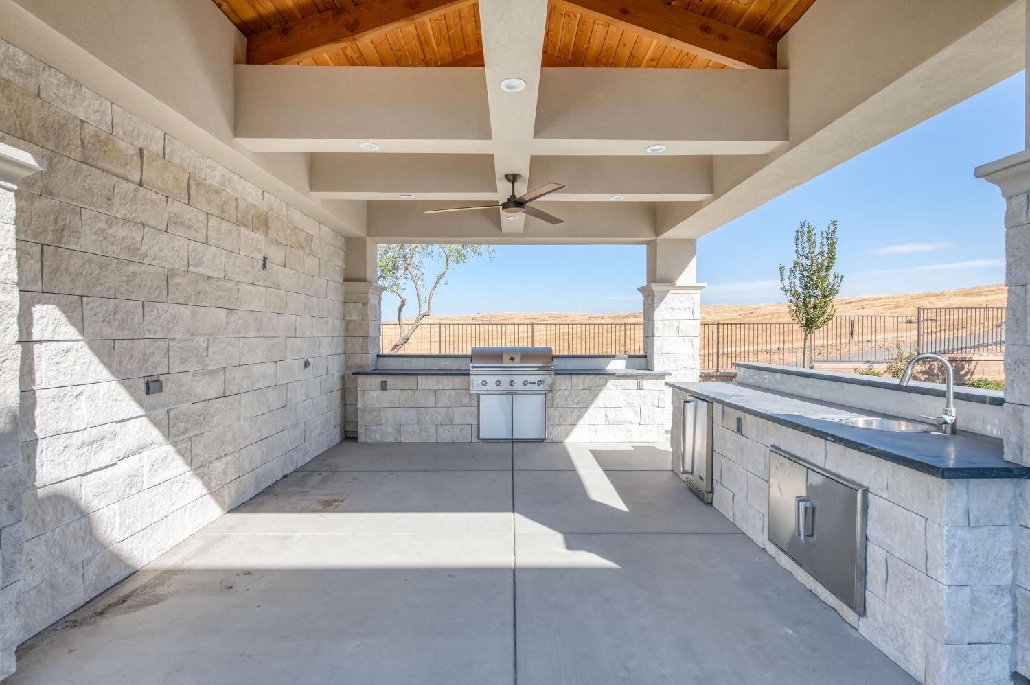 881 Terrace Place Madera, CA 93636 - Photo 48 of 85 a view of a kitchen with a sink and cabinets