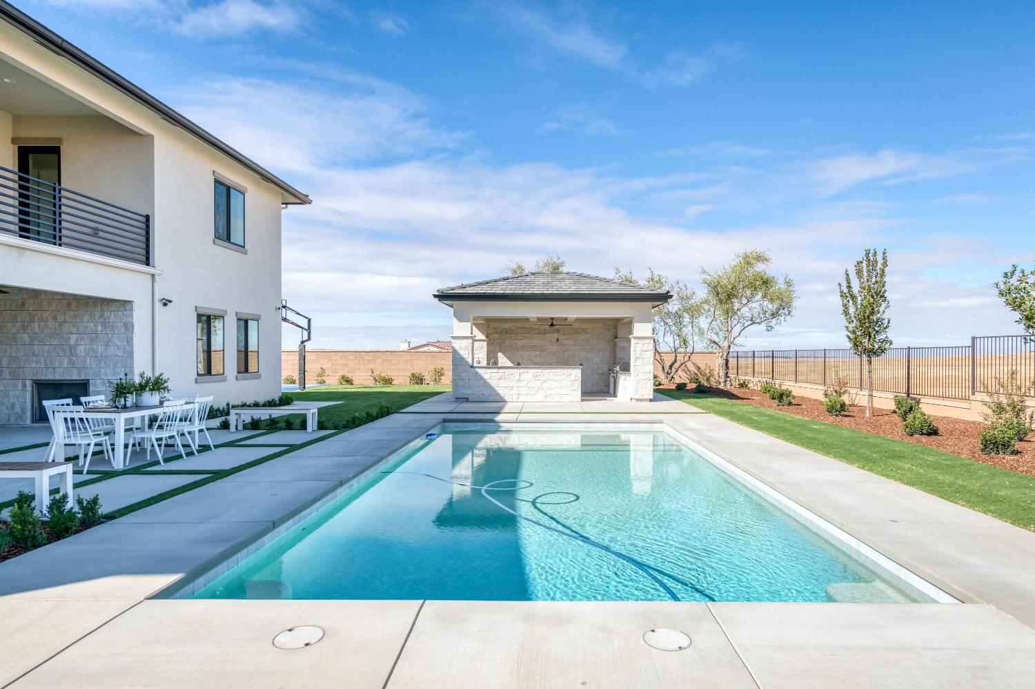 881 Terrace Place Madera, CA 93636 - Photo 53 of 85 a view of a house with a yard porch and sitting area