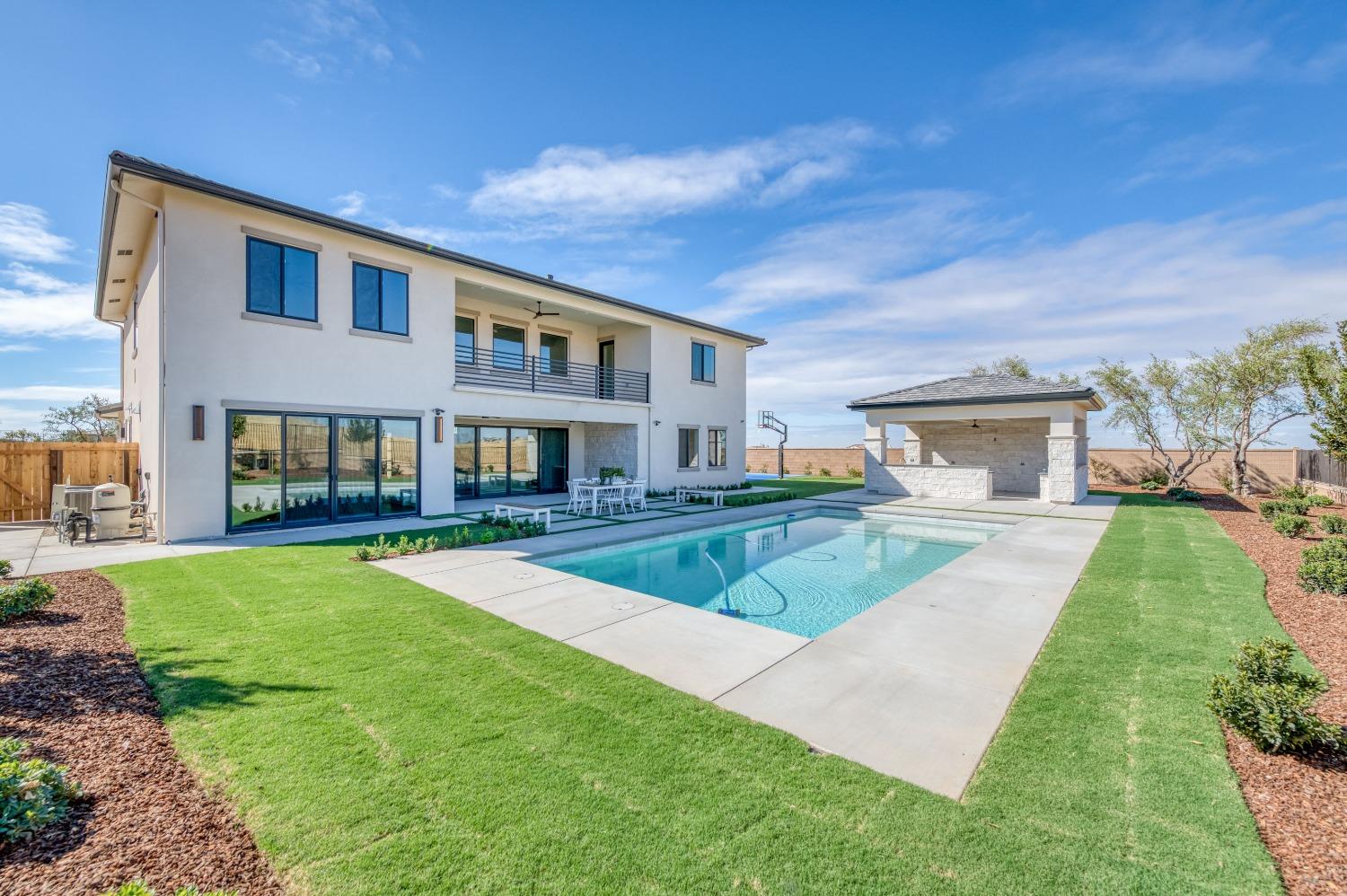 881 Terrace Place Madera, CA 93636 - Photo 54 of 85 a front view of a house with a yard