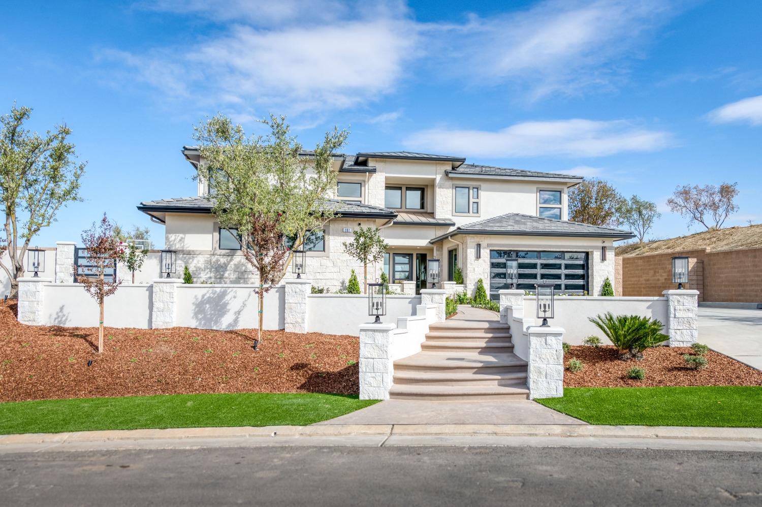 881 Terrace Place Madera, CA 93636 - Photo 8 of 85 a front view of a house with garden