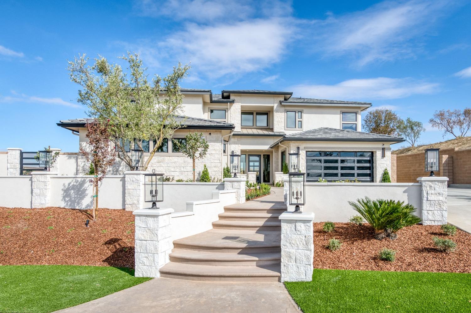881 Terrace Place Madera, CA 93636 - Photo 9 of 85 a front view of a house with a porch