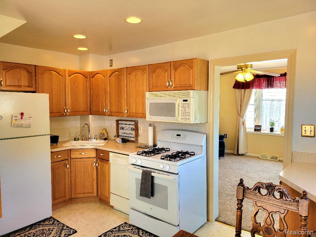 11227 Rivard Avenue Warren, MI 48089 - Photo 15 of 44 Kitchen featuring wood cabinetry, solid surface countertops, and recessed lighting