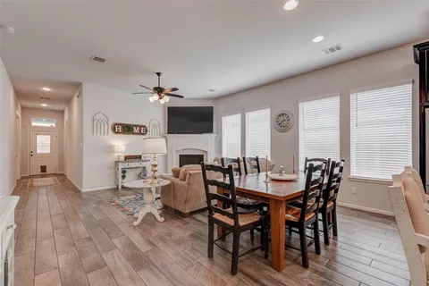 a view of a dining room with furniture and window