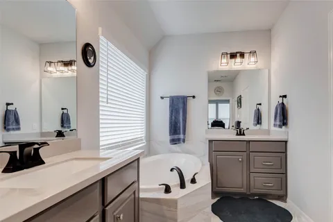 a kitchen with a sink cabinets and window