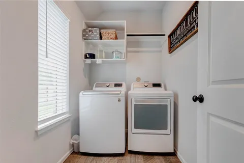 a utility room with dryer and washer