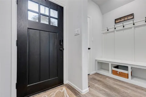a view of a livingroom with an empty space and a window