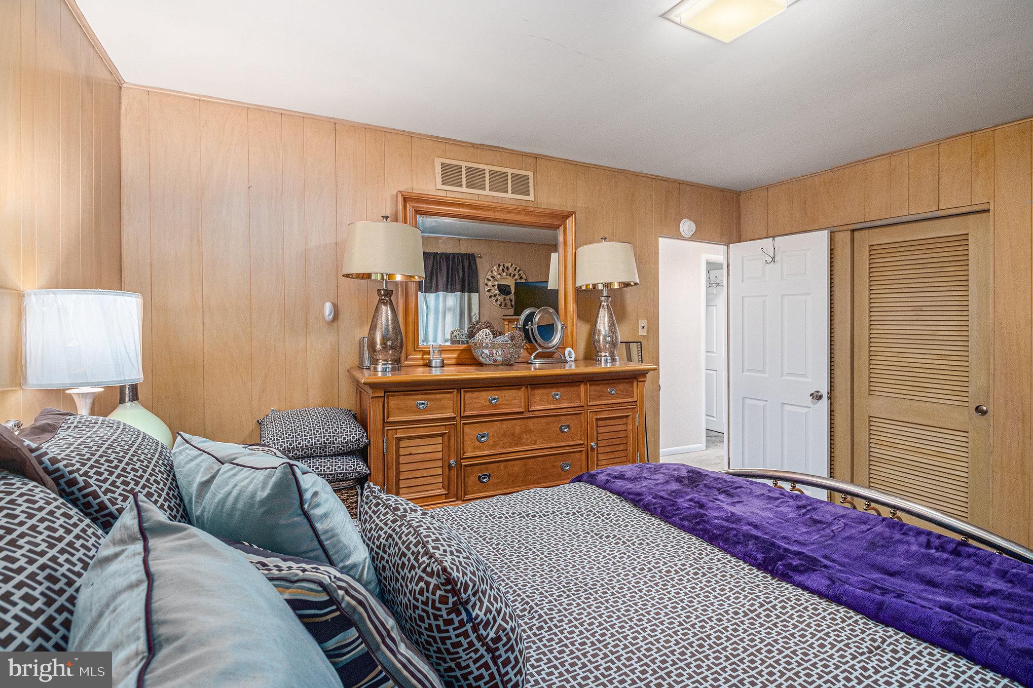 407 Rices Mill Road Wyncote, PA 19095 - Photo 16 of 29 a bedroom with a bed and a dresser