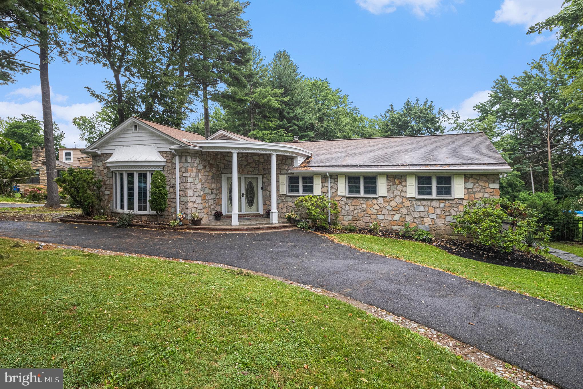 407 Rices Mill Road Wyncote, PA 19095 - Photo 2 of 29 a front view of a house with yard patio and green space