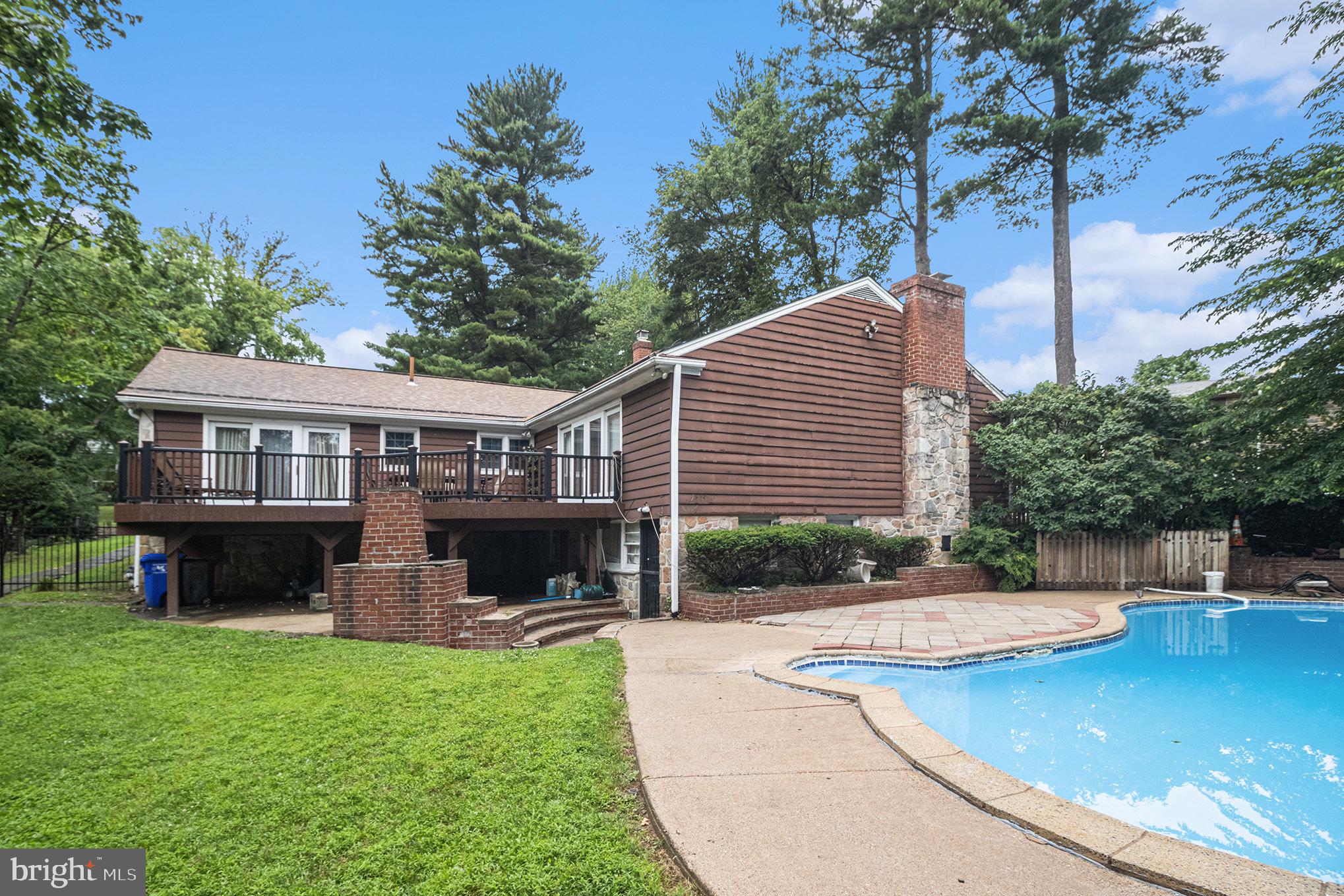 407 Rices Mill Road Wyncote, PA 19095 - Photo 28 of 29 a view of house with outdoor space and swimming pool