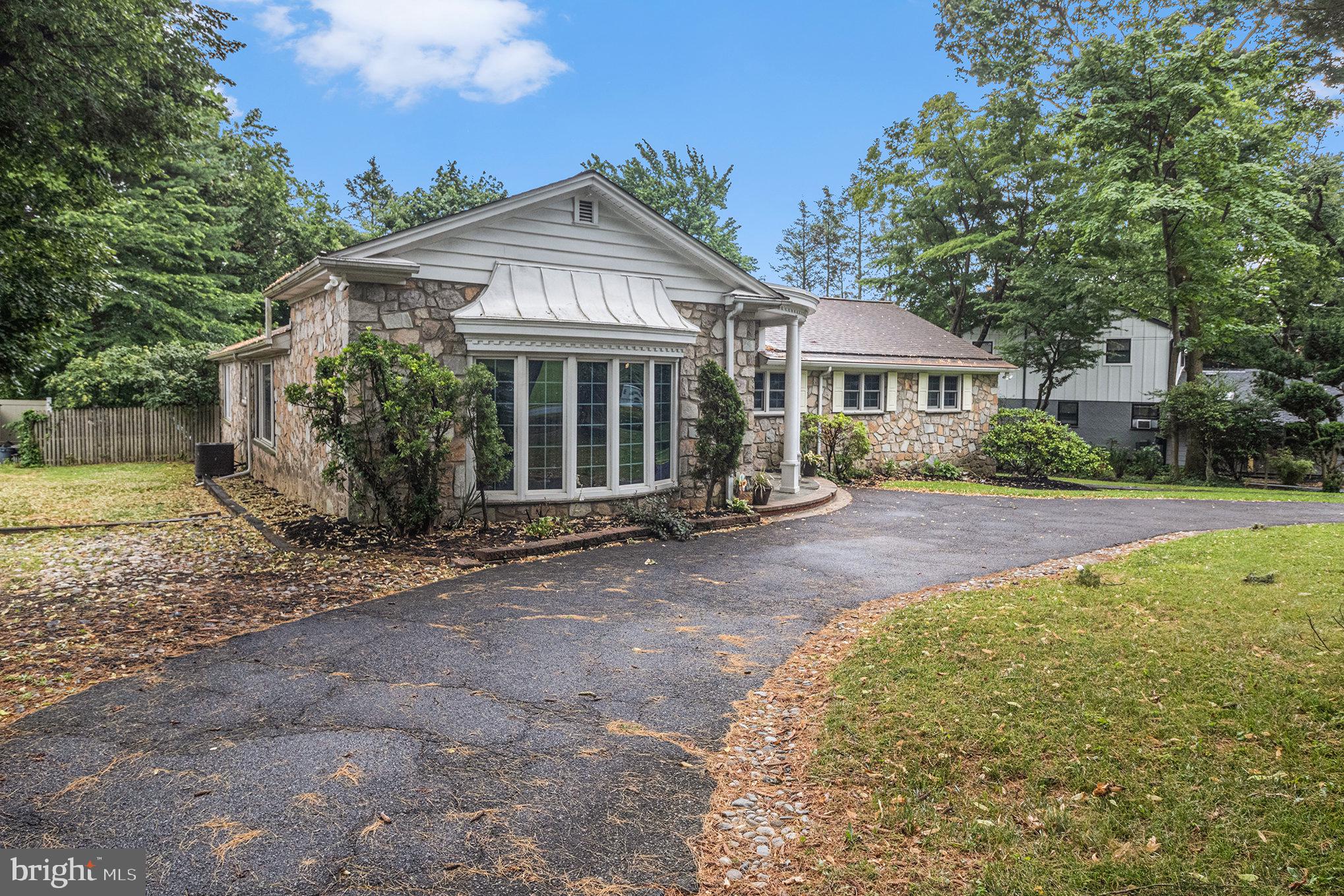 407 Rices Mill Road Wyncote, PA 19095 - Photo 3 of 29 a front view of a house with a garden