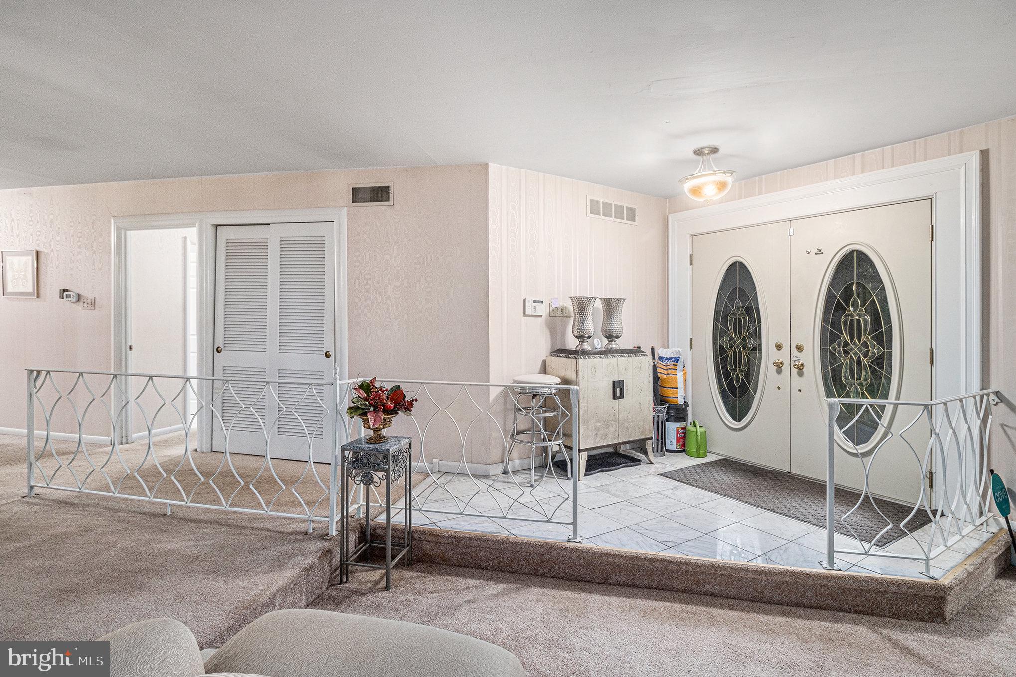 407 Rices Mill Road Wyncote, PA 19095 - Photo 4 of 29 a view of a livingroom with furniture and white walls