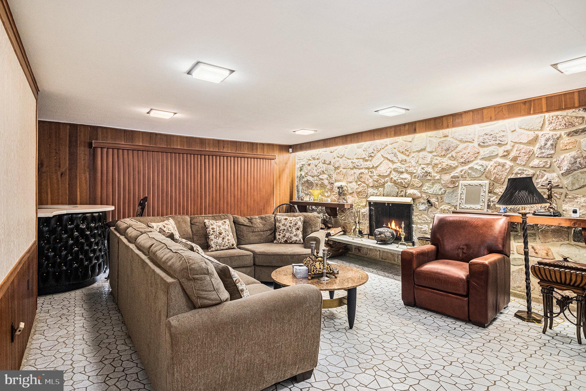 407 Rices Mill Road Wyncote, PA 19095 - Photo 9 of 29 a living room with furniture window and a fireplace