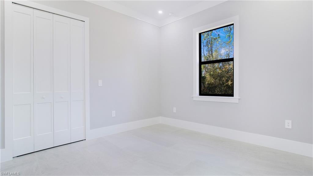 3518 2nd Avenue Southeast Naples, FL 34117 - Photo 17 of 41 a view of an empty room with a window