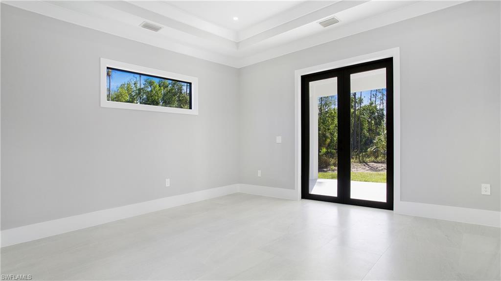 3518 2nd Avenue Southeast Naples, FL 34117 - Photo 23 of 41 an empty room with windows and closet
