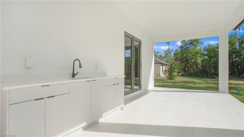 3518 2nd Avenue Southeast Naples, FL 34117 - Photo 30 of 41 a bathroom with a sink and mirror