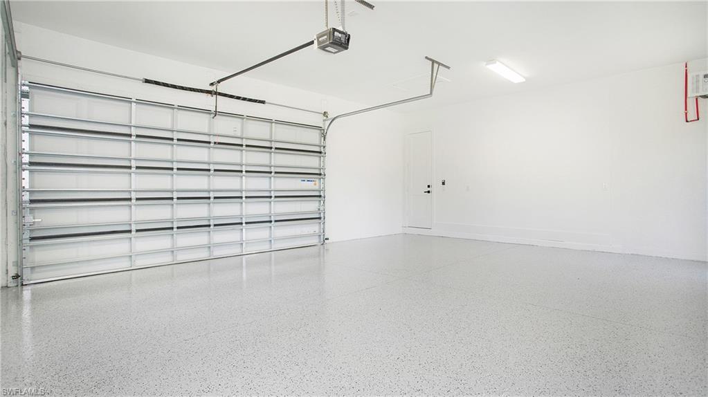 3518 2nd Avenue Southeast Naples, FL 34117 - Photo 32 of 41 a view of a room with shelf and racks on the wall