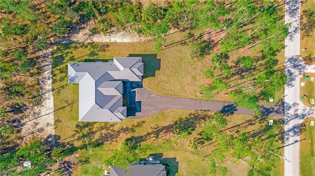 3518 2nd Avenue Southeast Naples, FL 34117 - Photo 39 of 41 front view of a house with a yard