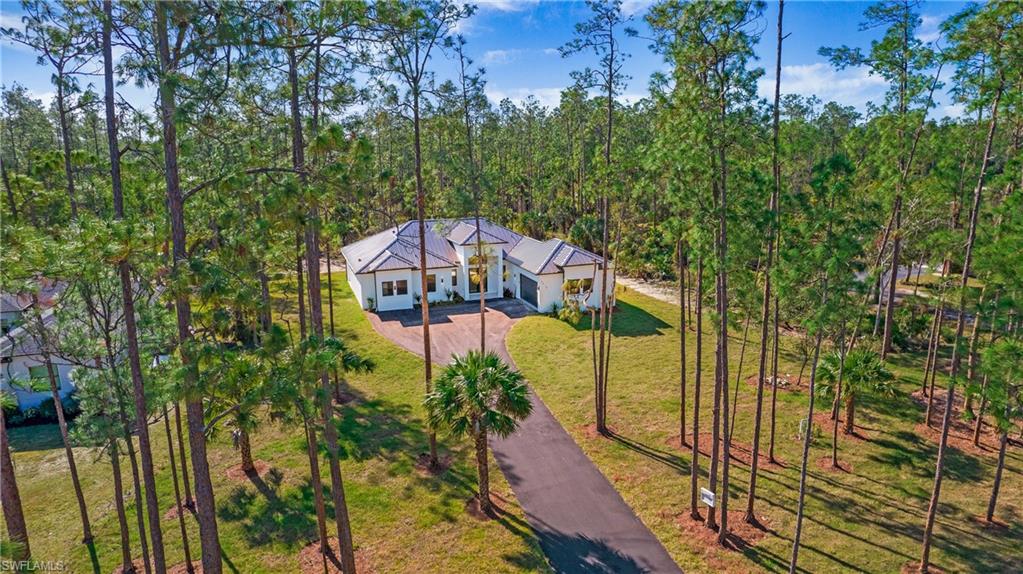 3518 2nd Avenue Southeast Naples, FL 34117 - Photo 40 of 41 a view of a balcony with yard