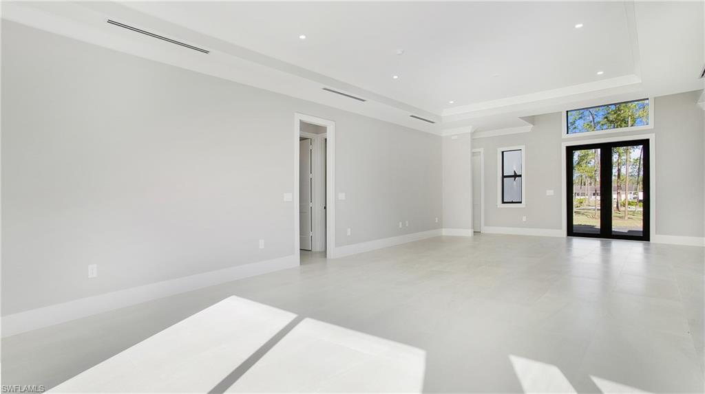 3518 2nd Avenue Southeast Naples, FL 34117 - Photo 6 of 41 a view of an empty room with a window