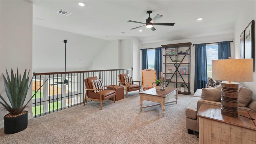 1016 Pitchfork Road Royse City, TX 75189 - Photo 30 of 35 a living room with furniture and floor to ceiling window