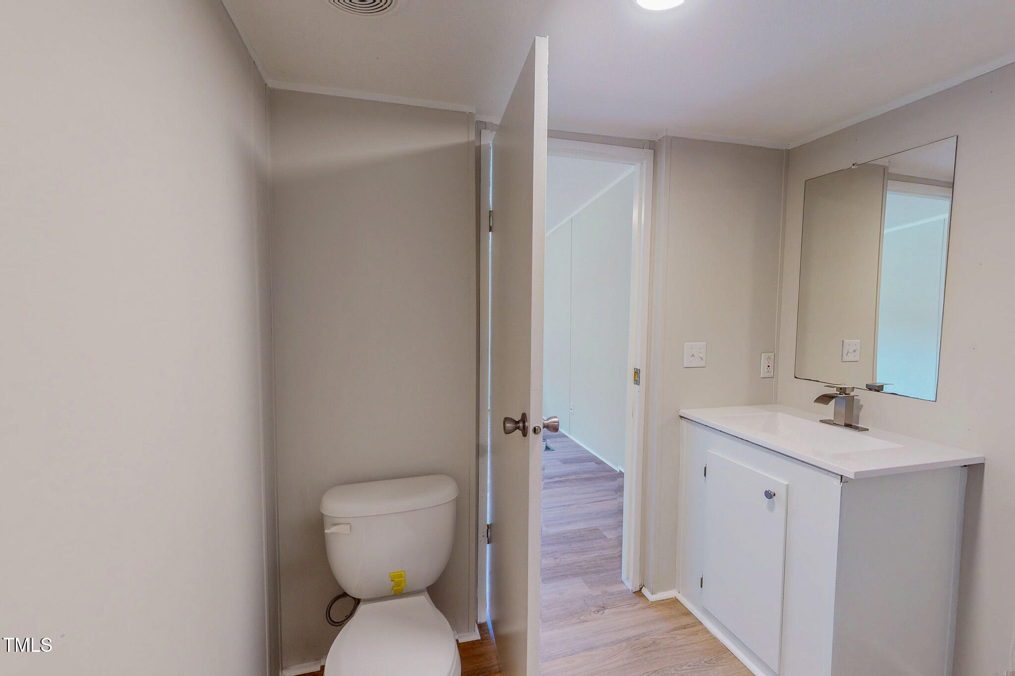72 Red Field Lane Timberlake, NC 27583 - Photo 16 of 36 a bathroom with a toilet sink and mirror