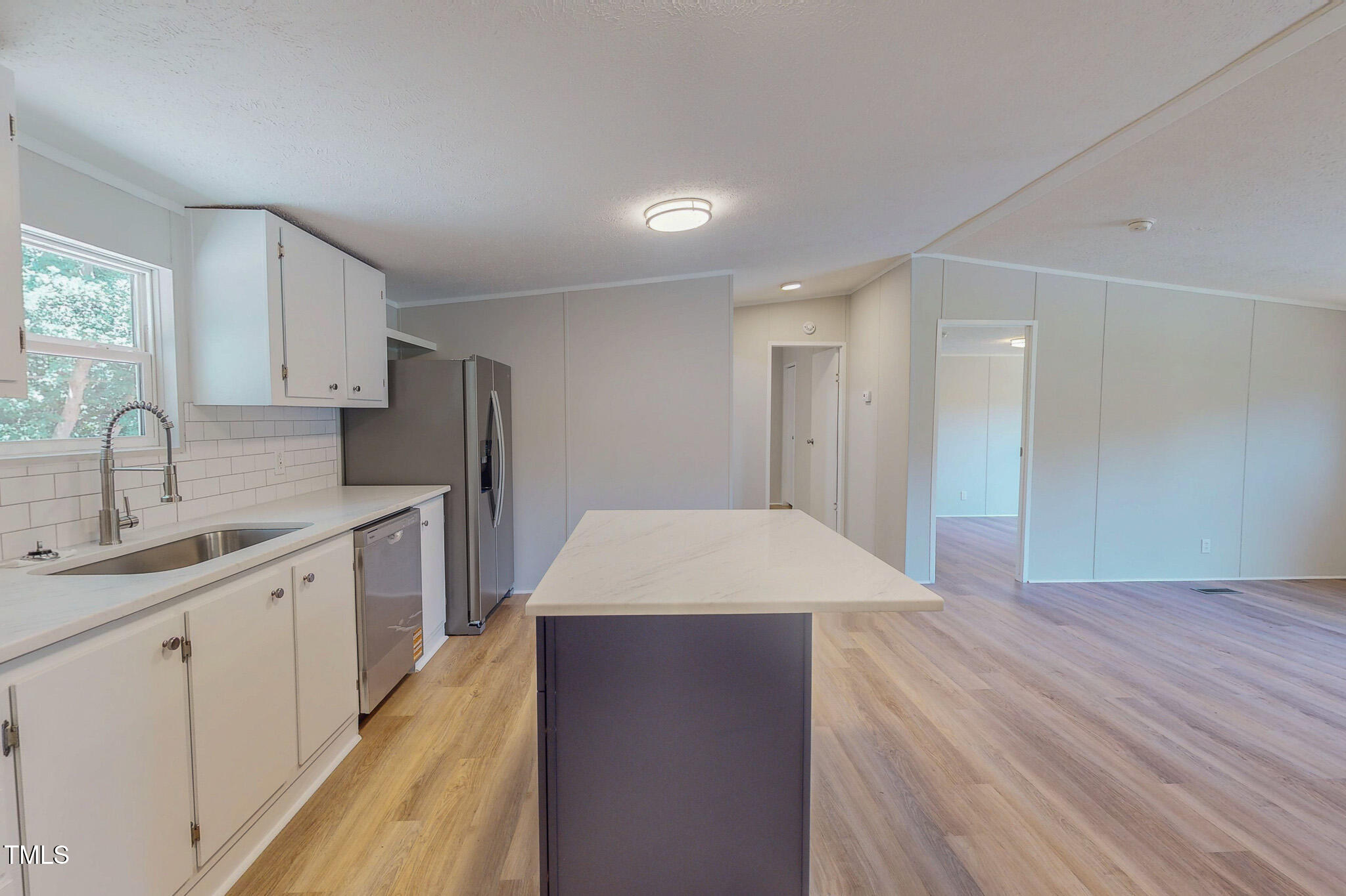 72 Red Field Lane Timberlake, NC 27583 - Photo 20 of 36 a open kitchen with kitchen island a sink stainless steel appliances and cabinets
