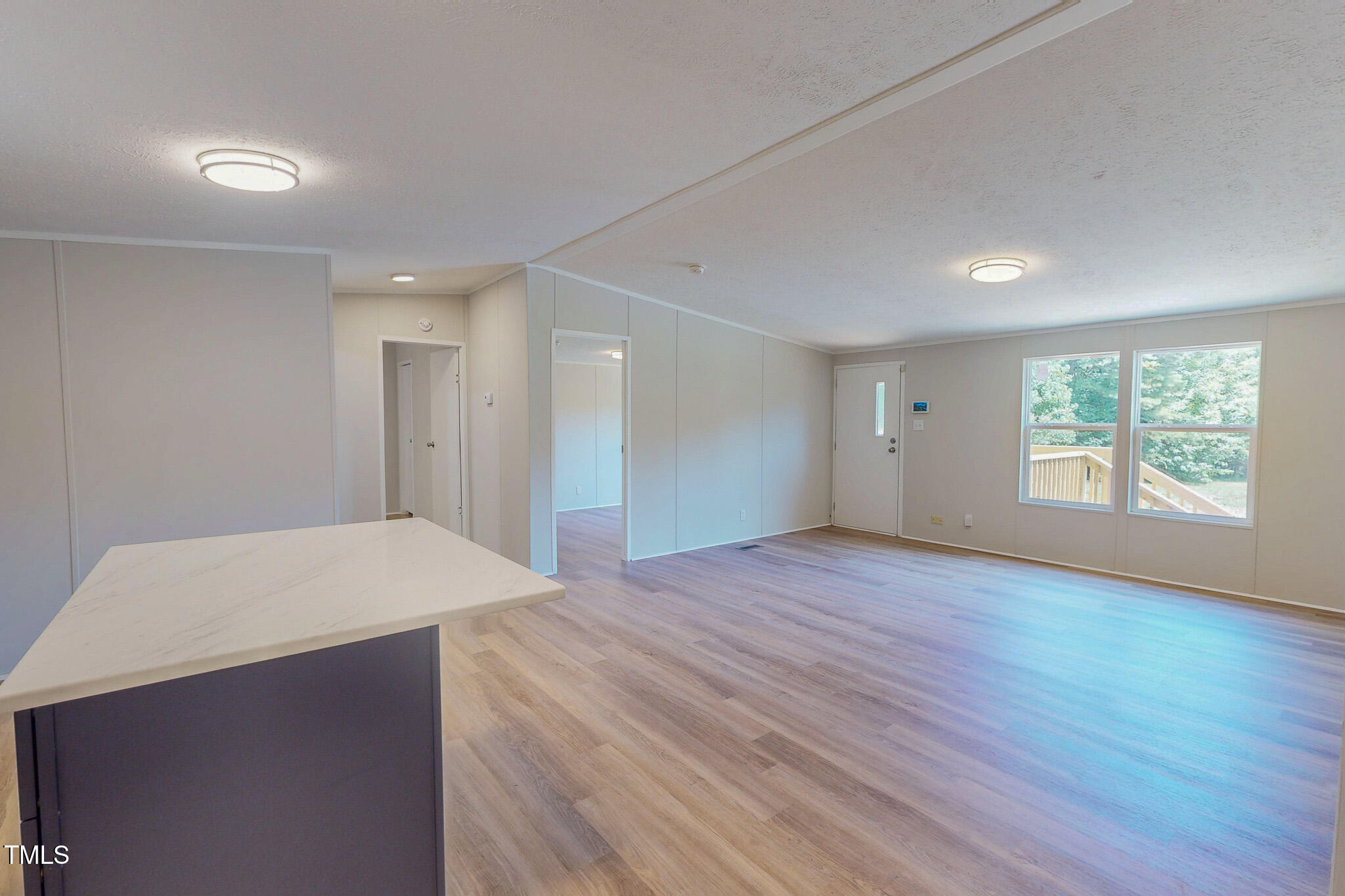 72 Red Field Lane Timberlake, NC 27583 - Photo 24 of 36 a big room with wooden floor and windows