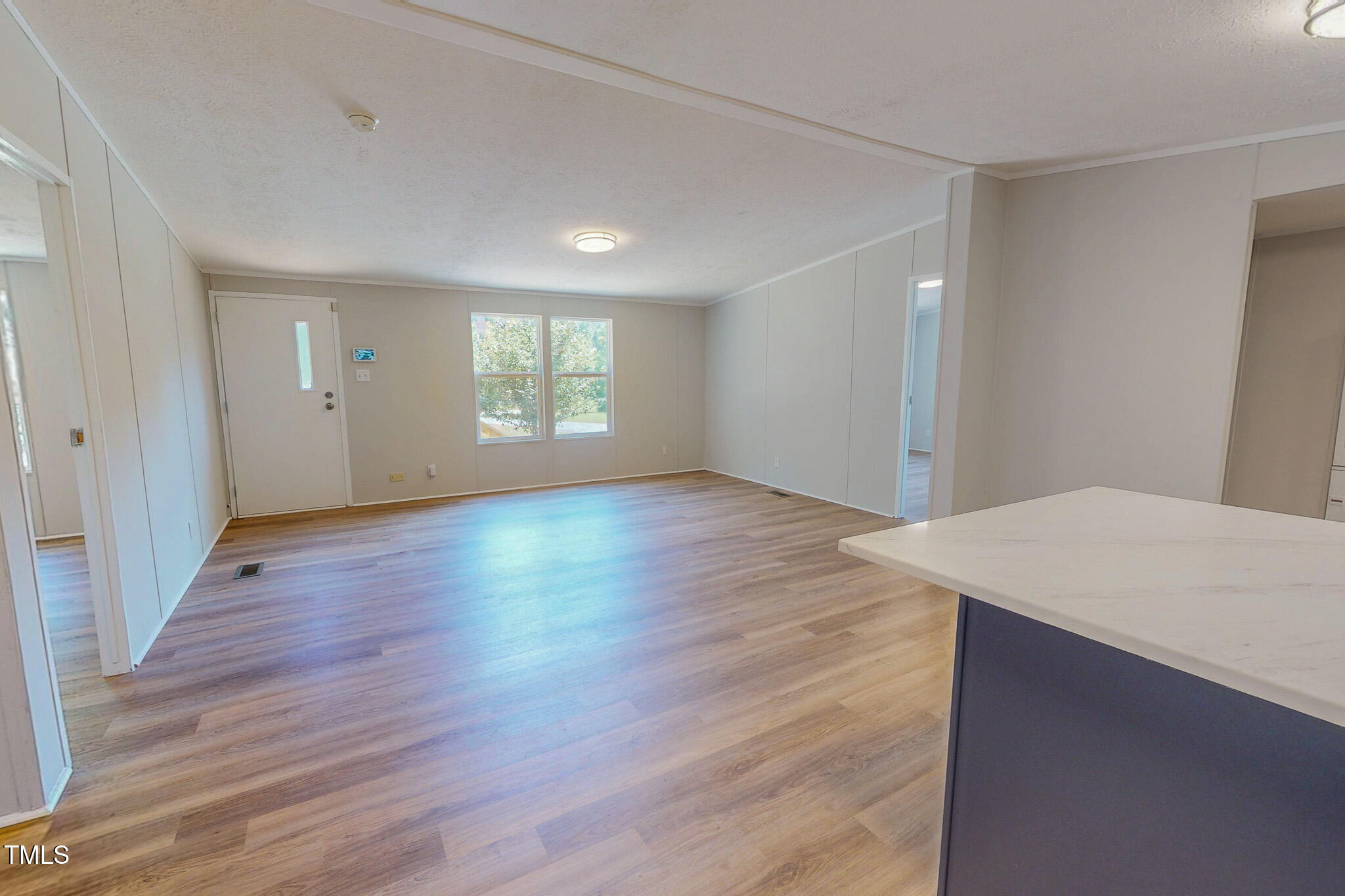 72 Red Field Lane Timberlake, NC 27583 - Photo 26 of 36 an empty room with wooden floor and windows