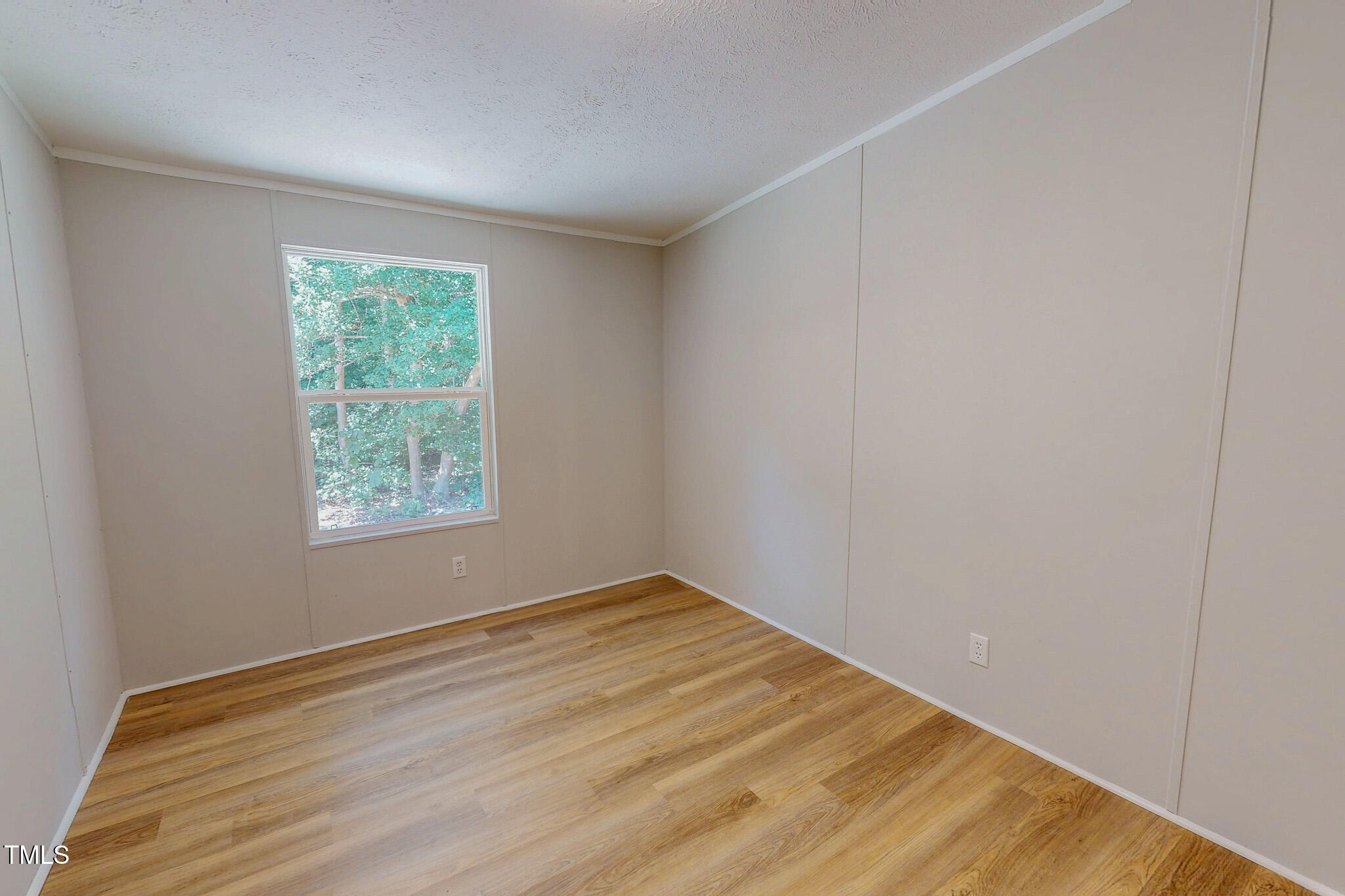 72 Red Field Lane Timberlake, NC 27583 - Photo 30 of 36 an empty room with wooden floor and windows