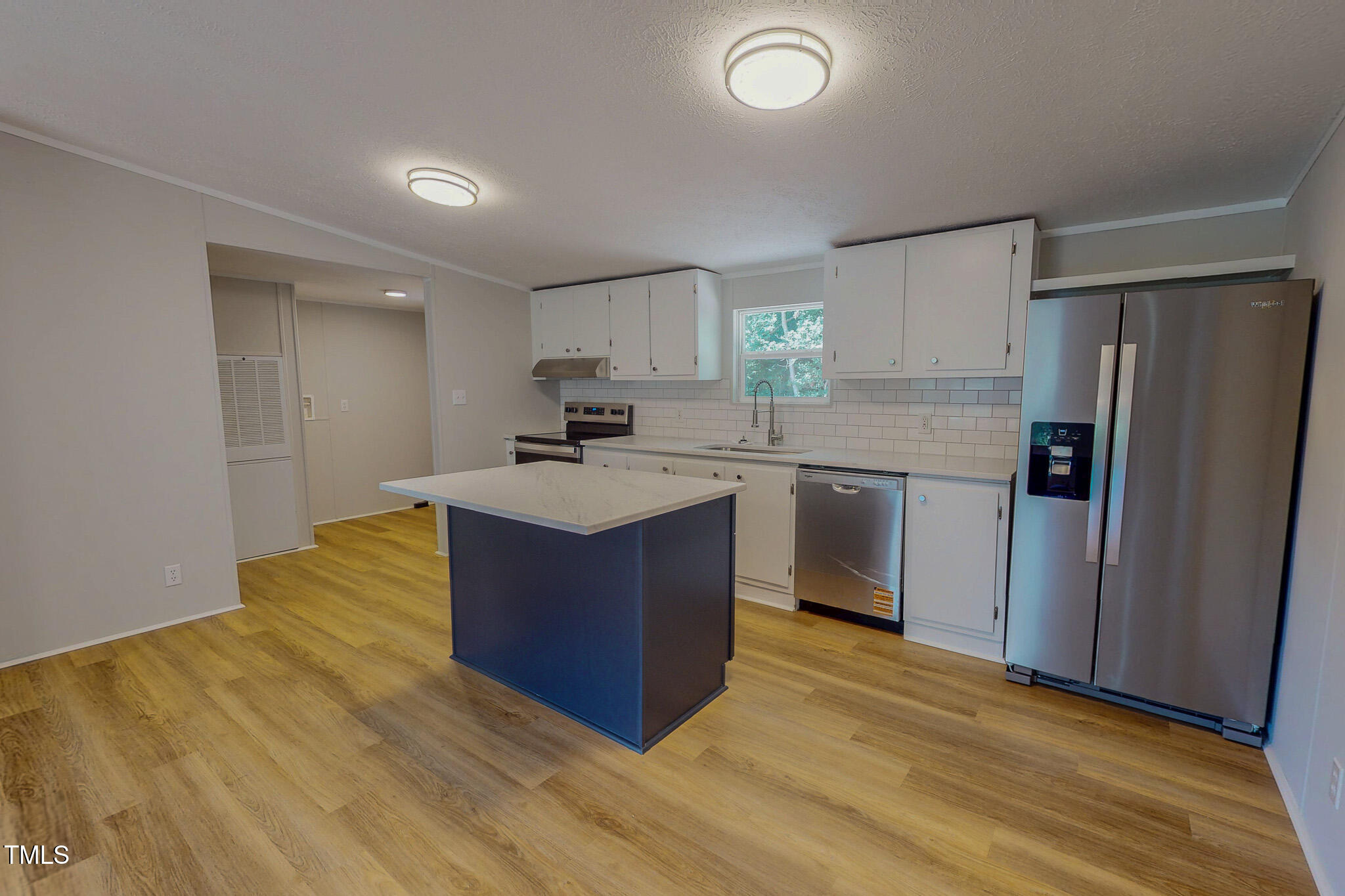 72 Red Field Lane Timberlake, NC 27583 - Photo 7 of 36 a kitchen with stainless steel appliances granite countertop a sink stove refrigerator and cabinets
