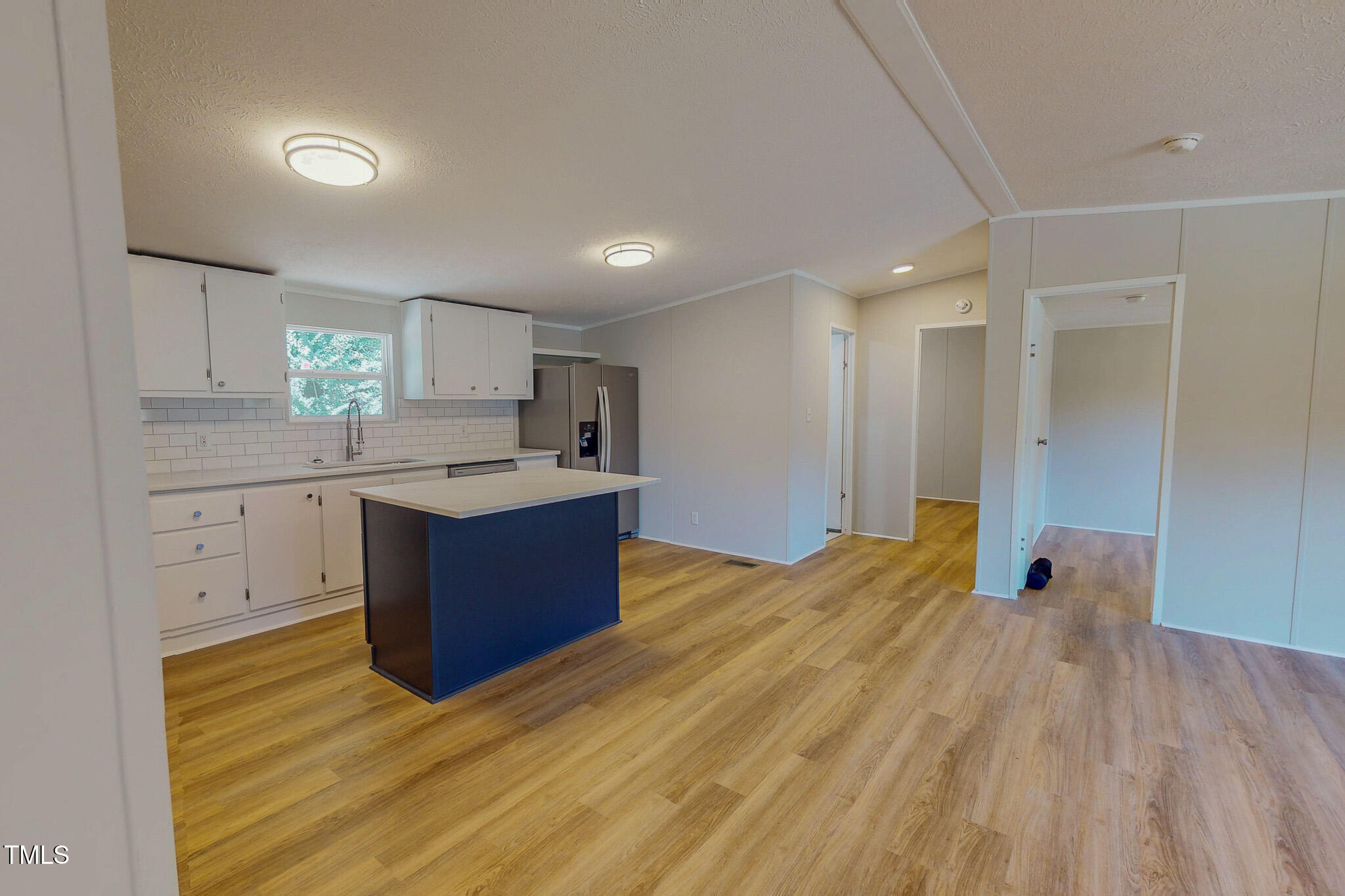 72 Red Field Lane Timberlake, NC 27583 - Photo 8 of 36 a kitchen with stainless steel appliances granite countertop a sink cabinets and wooden floor