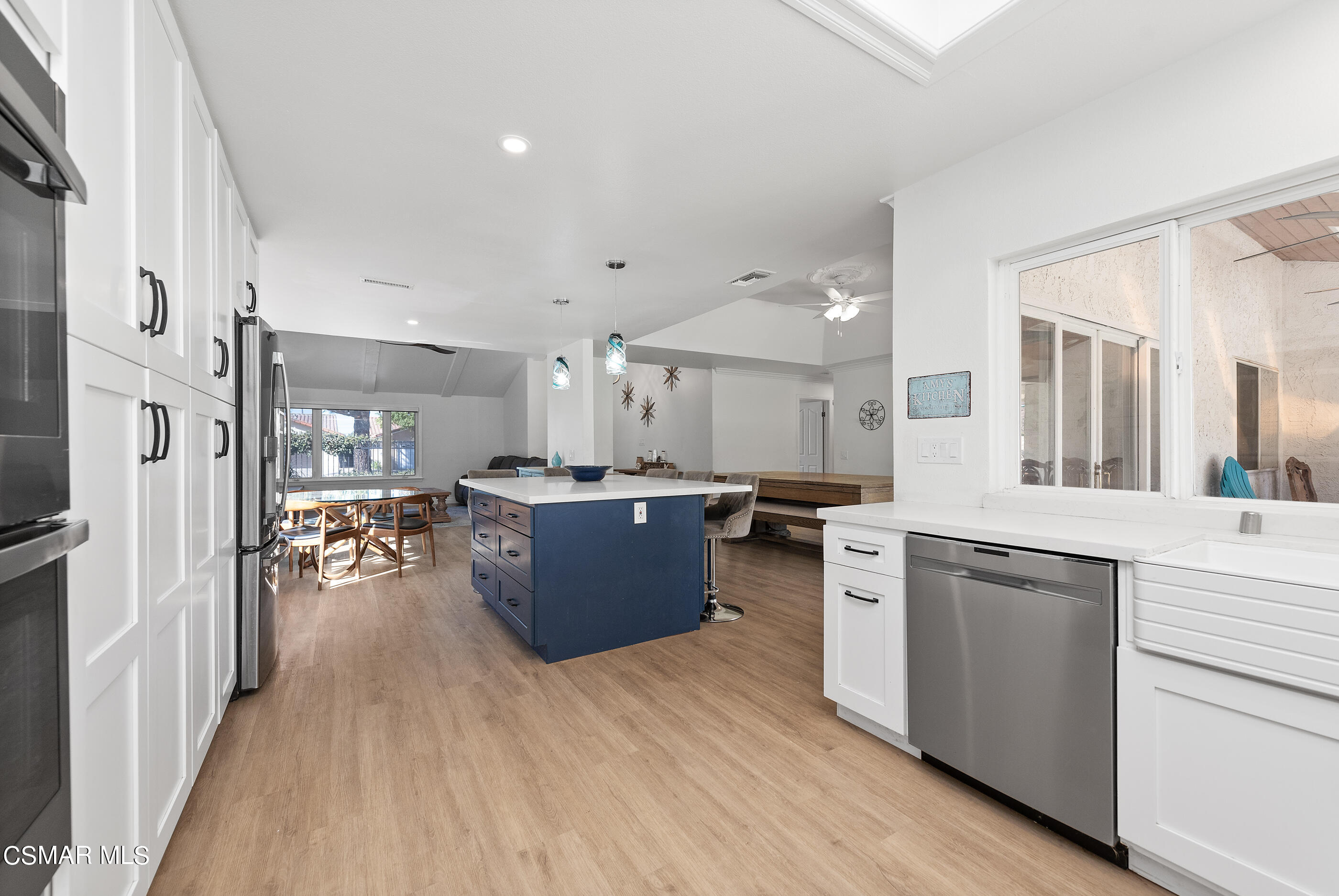 3386 Texas Avenue Simi Valley, CA 93063 - Photo 20 of 71 a large kitchen with stainless steel appliances lots of counter space and wooden floors