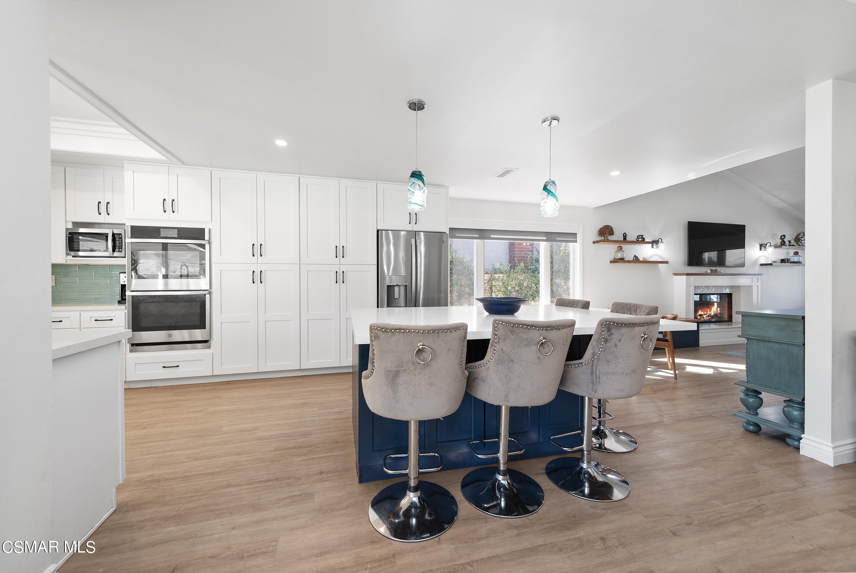3386 Texas Avenue Simi Valley, CA 93063 - Photo 24 of 71 a dining room with kitchen island stainless steel appliances furniture and kitchen view