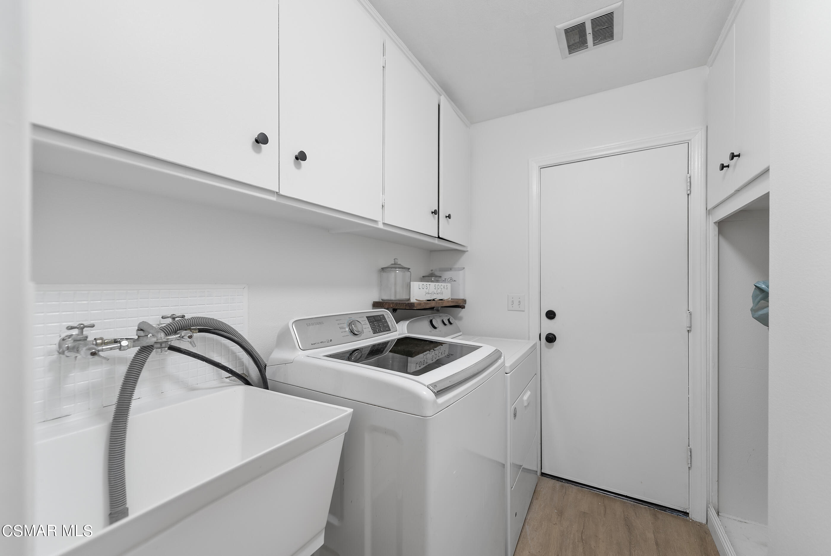 3386 Texas Avenue Simi Valley, CA 93063 - Photo 25 of 71 a view of storage and utility room with washer and dryer