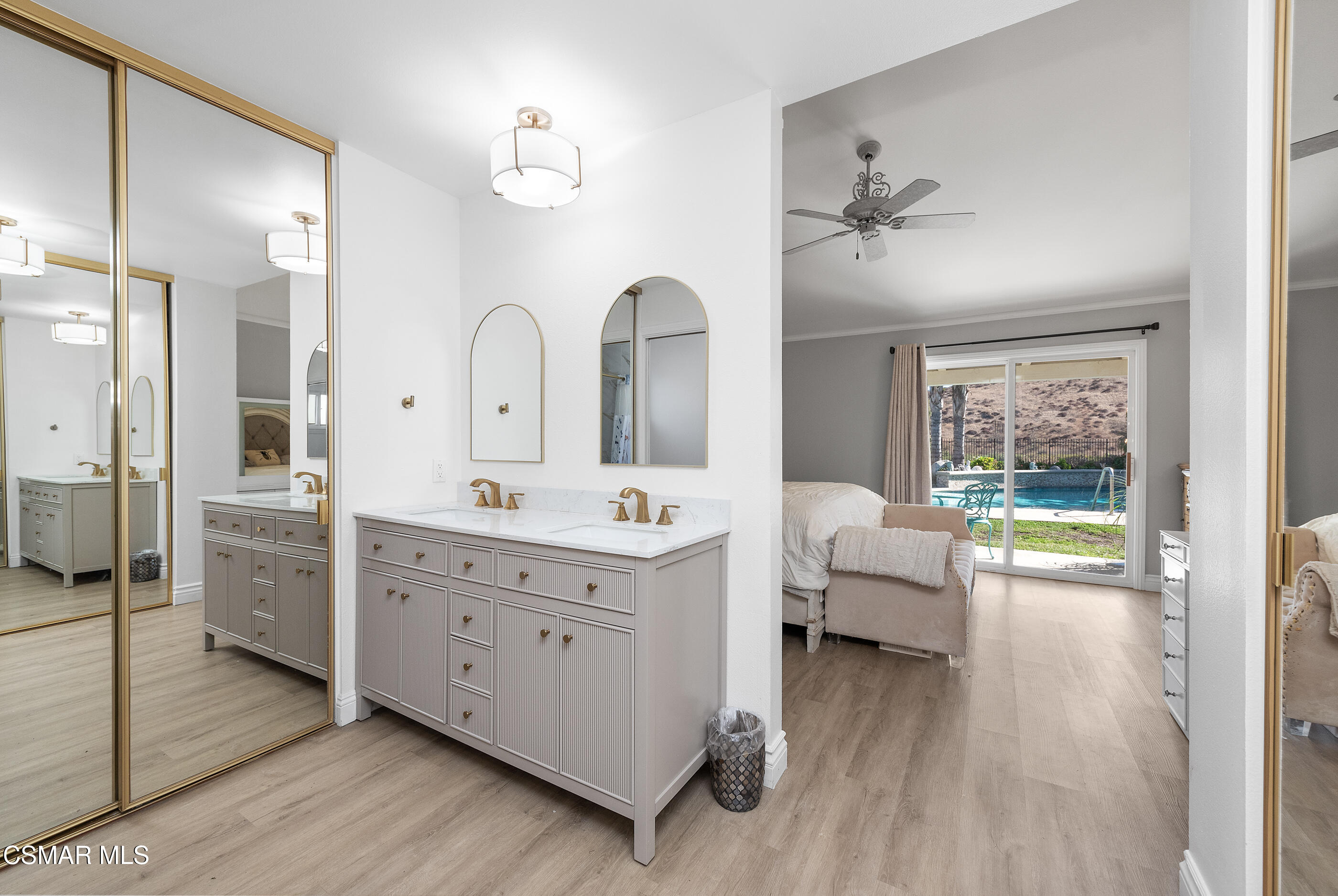 3386 Texas Avenue Simi Valley, CA 93063 - Photo 31 of 71 a spacious bathroom with a double vanity sink a mirror a bathtub and shower