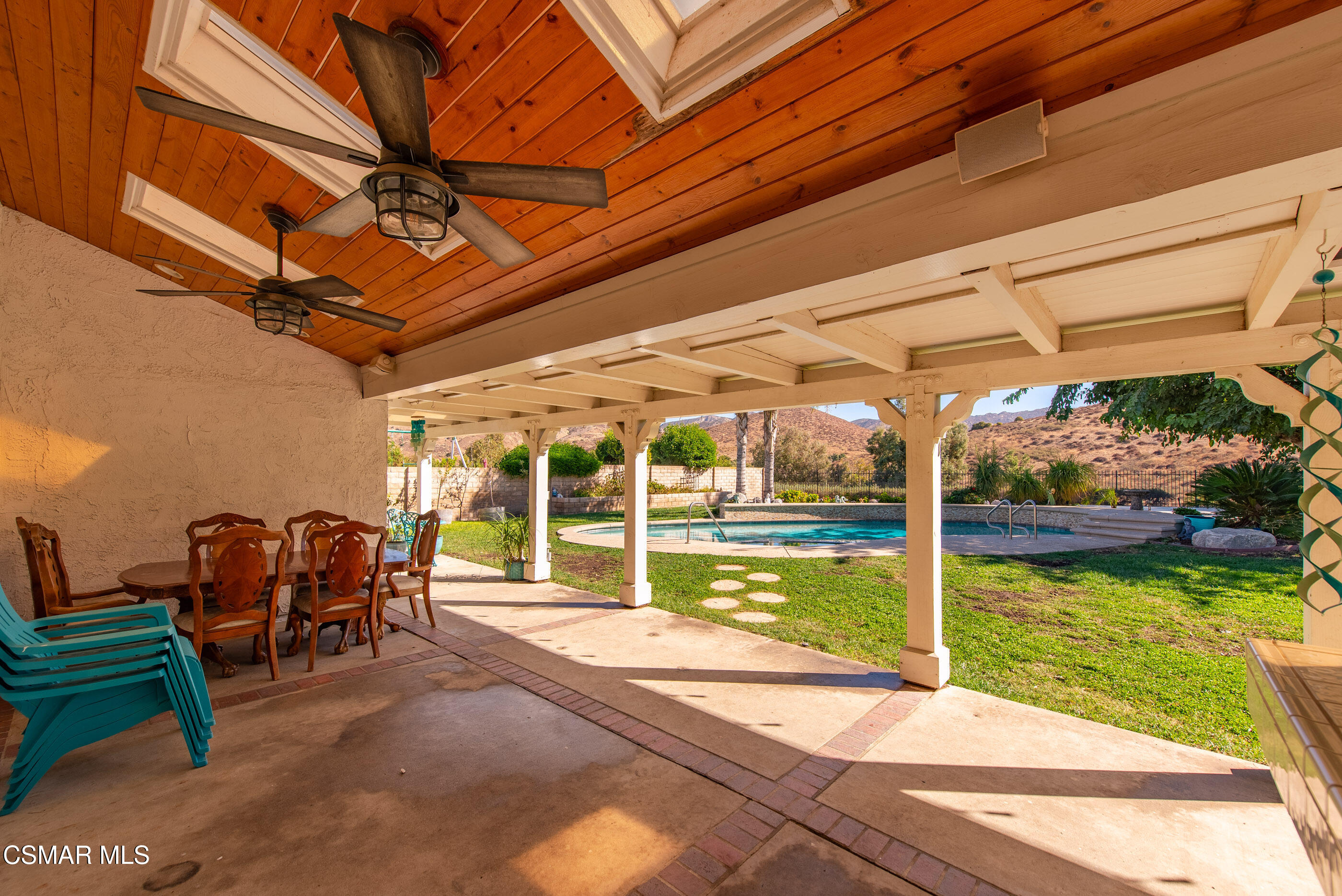 3386 Texas Avenue Simi Valley, CA 93063 - Photo 37 of 71 a view of a patio with table and chairs next to a yard