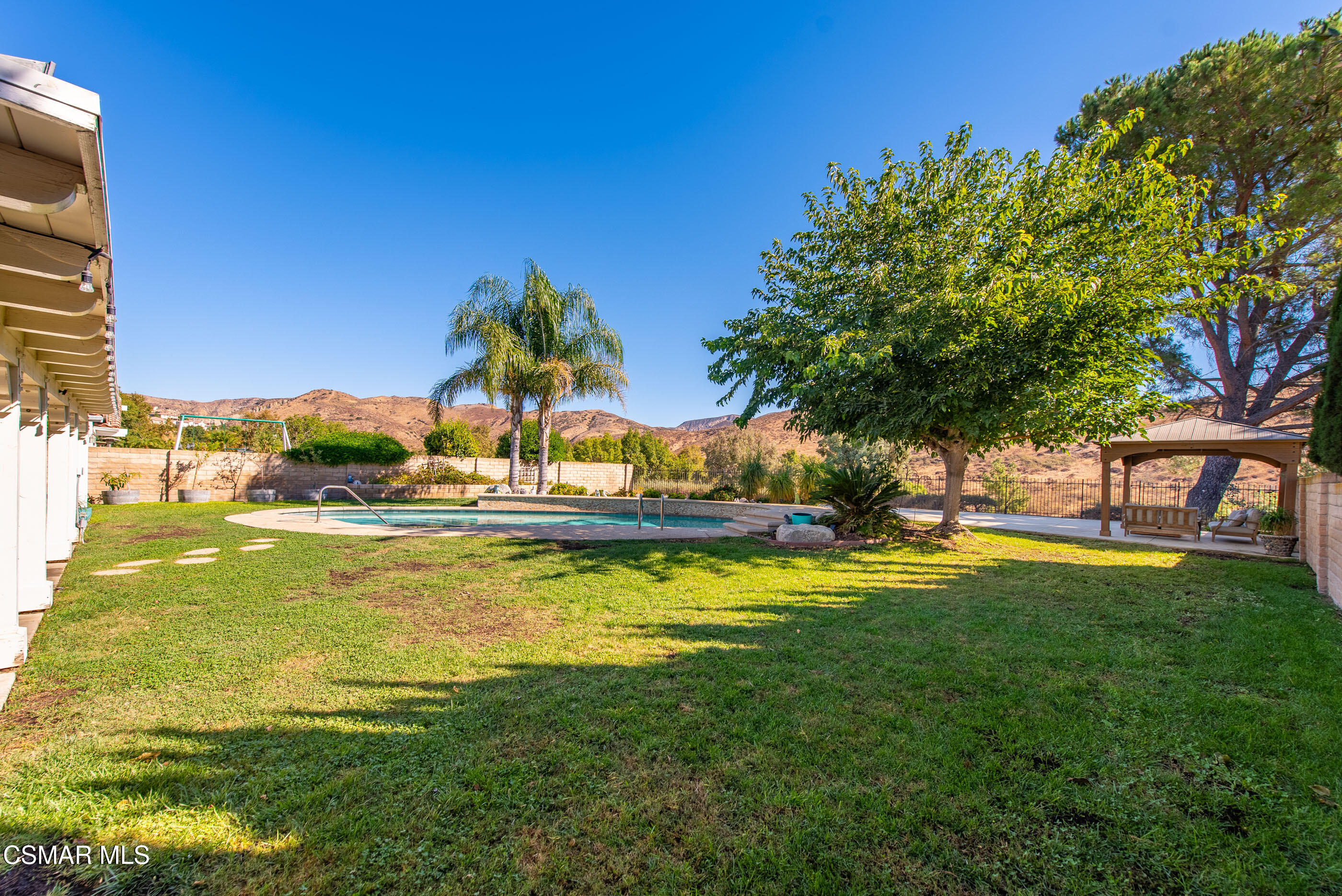 3386 Texas Avenue Simi Valley, CA 93063 - Photo 39 of 71 a view of a swimming pool with an outdoor space and seating area