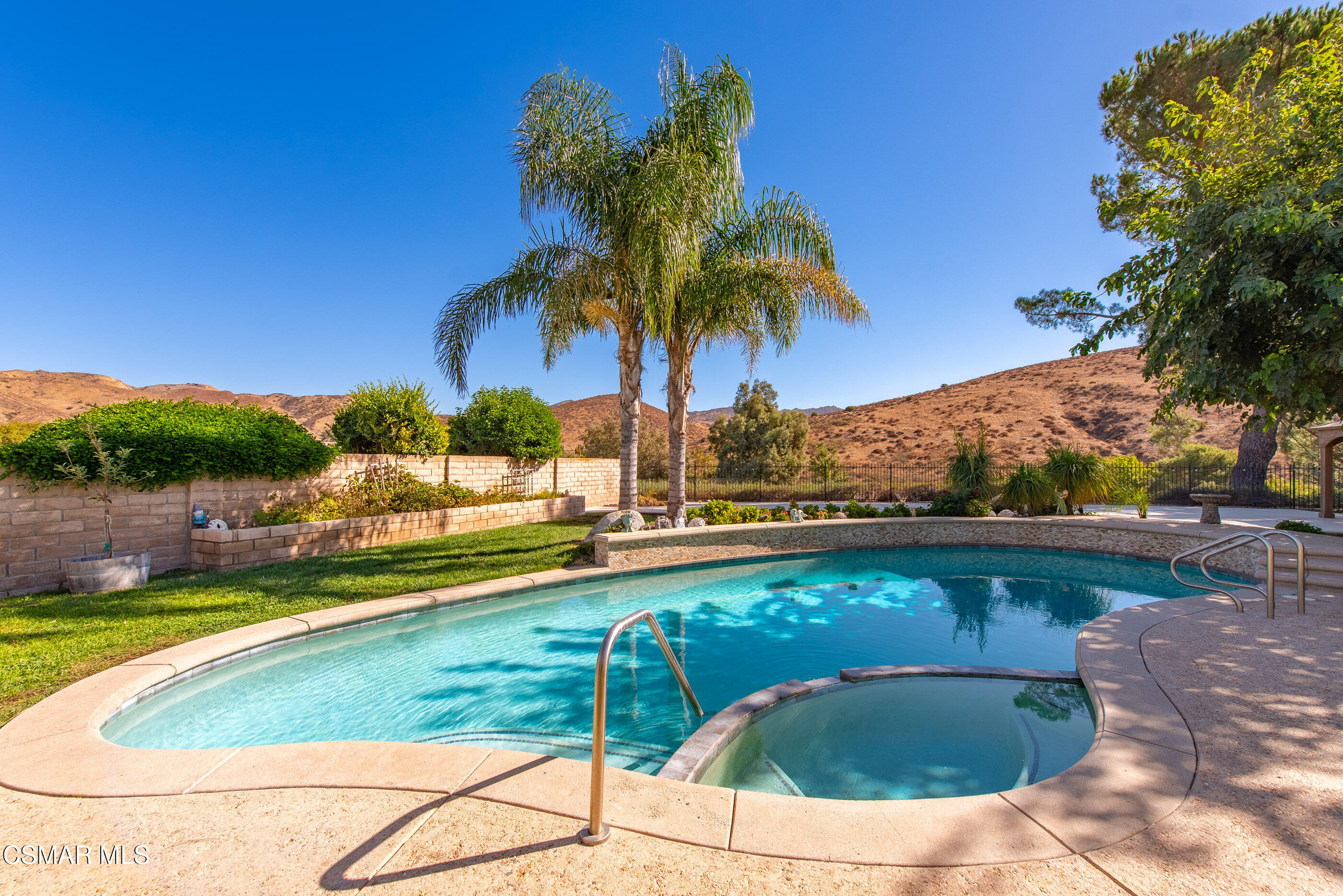 3386 Texas Avenue Simi Valley, CA 93063 - Photo 40 of 71 a view of swimming pool with a table and chairs