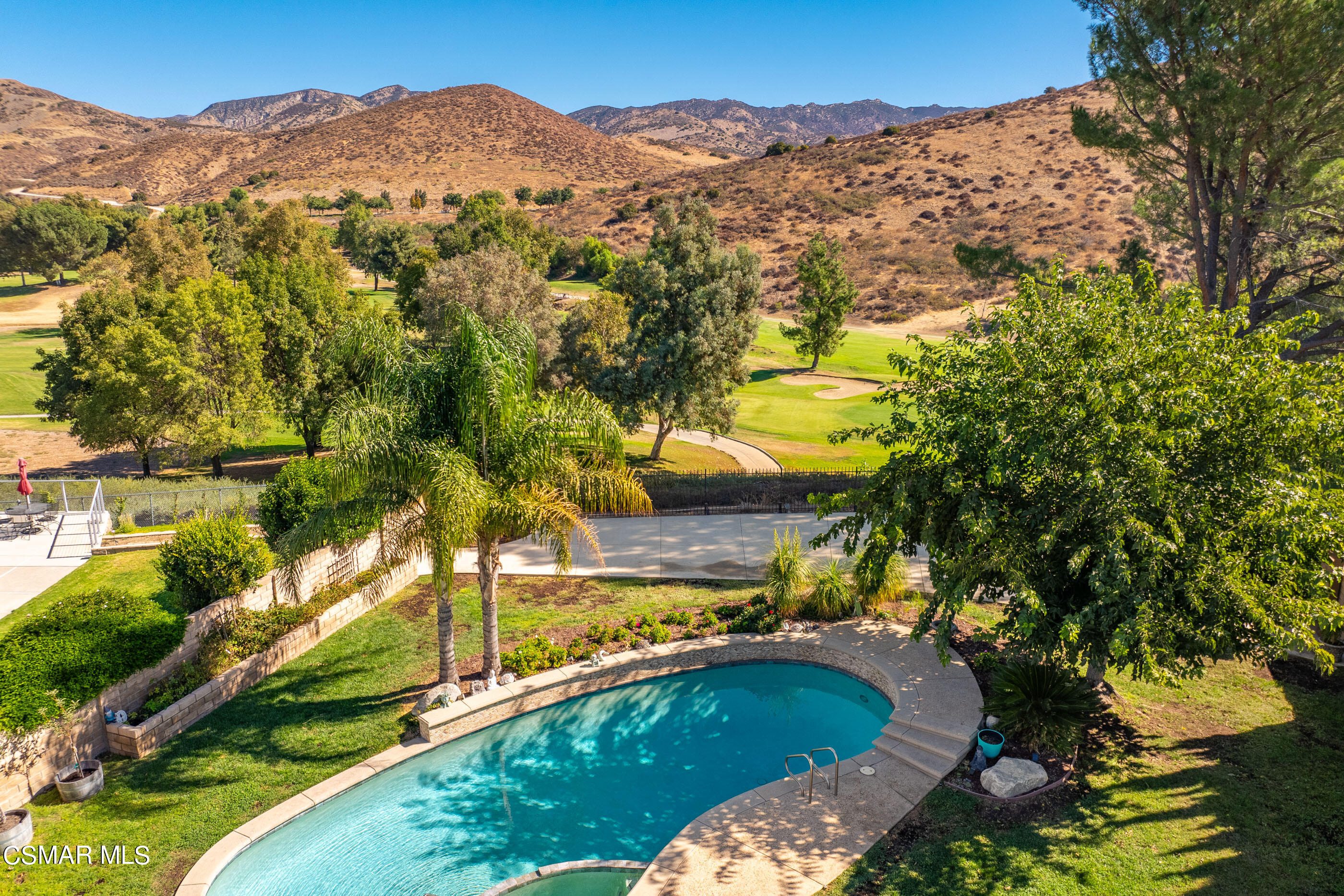 3386 Texas Avenue Simi Valley, CA 93063 - Photo 4 of 71 a view of a house with a mountain and a forest