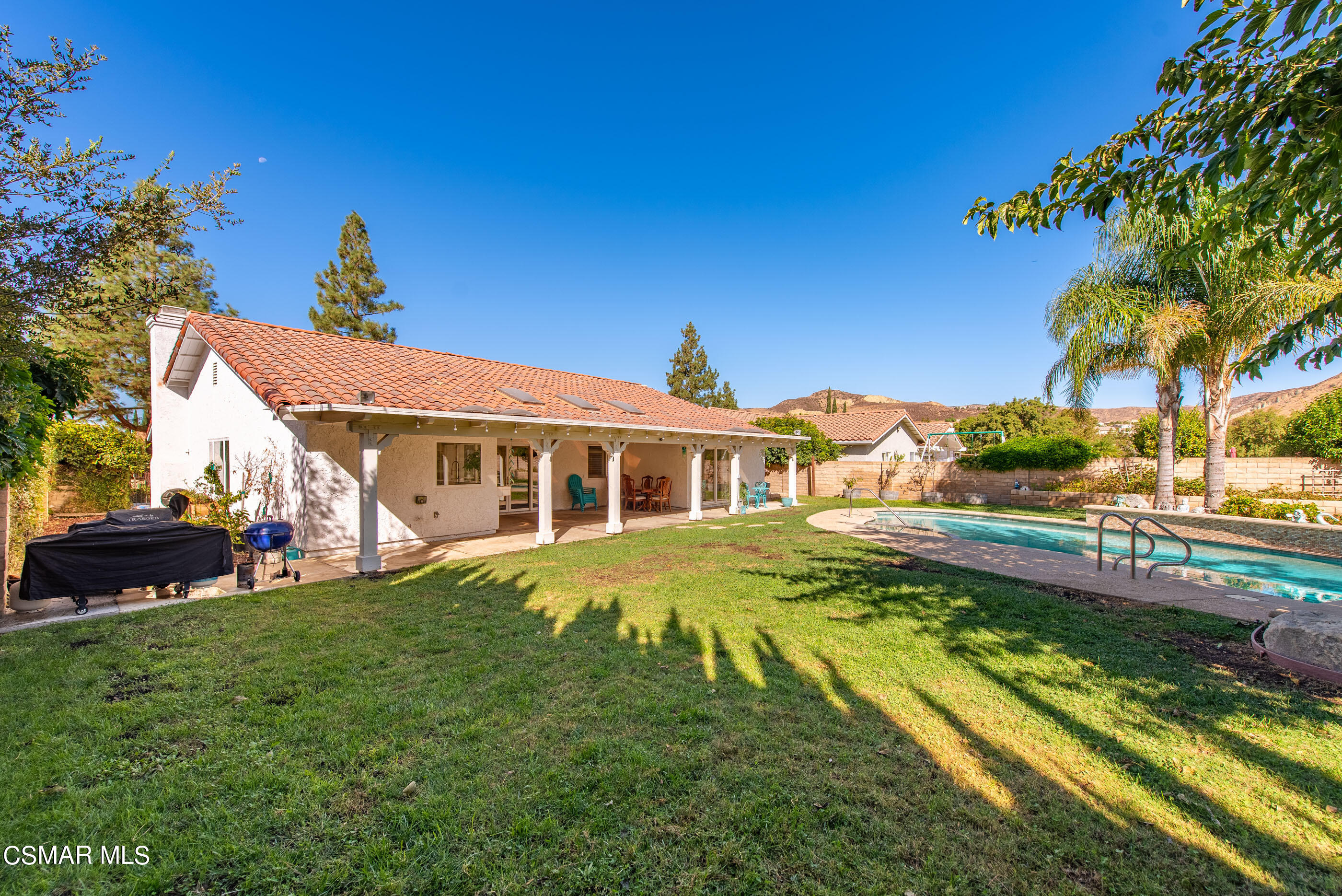3386 Texas Avenue Simi Valley, CA 93063 - Photo 57 of 71 a front view of a house with a yard table and chairs