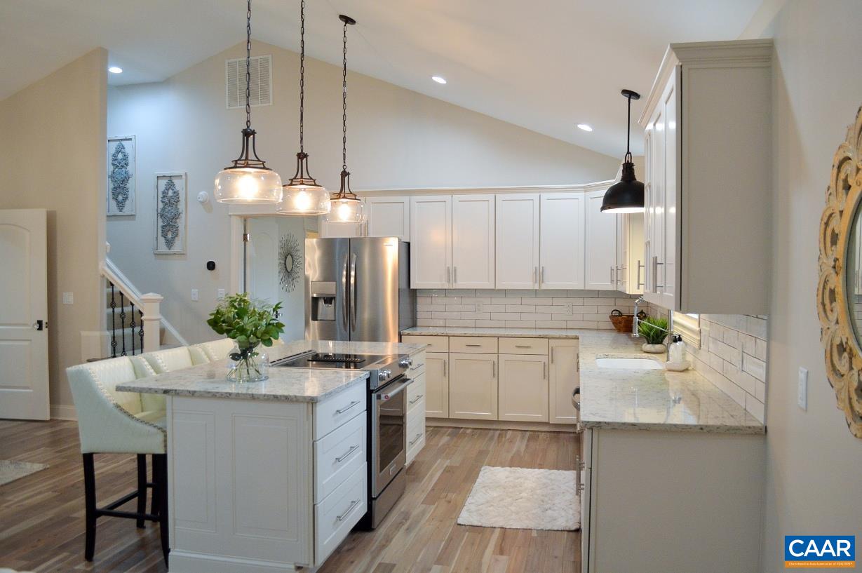 275 Blue Ridge Road Ruckersville, VA 22968 - Photo 8 of 59 a kitchen with a sink stove and cabinets