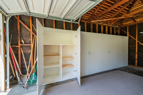 a view of an empty room with a door