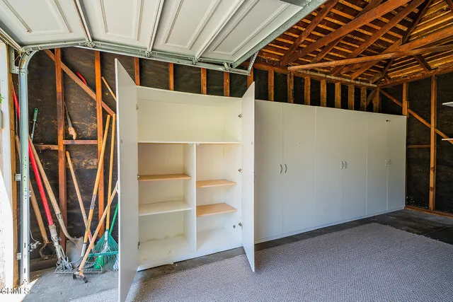 a view of an empty room with a door