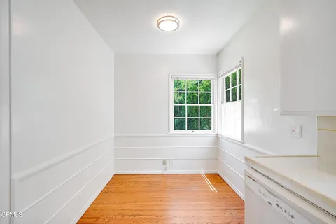 a view of a kitchen with a tub and windows