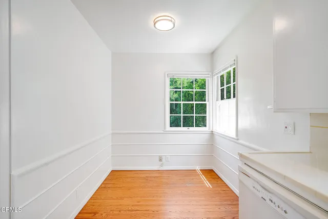 a view of a kitchen with a tub and windows