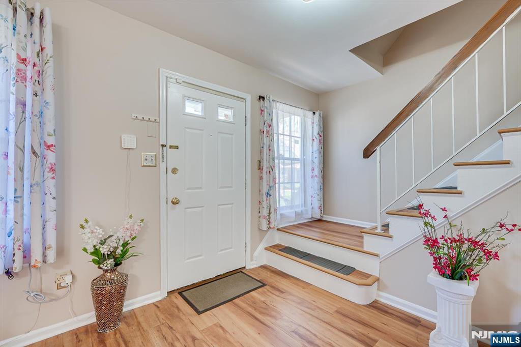 1402 Maplecrest Road, Unit 1402 Edison, NJ 08820 - Photo 12 of 37 a view of an entryway with wooden floor