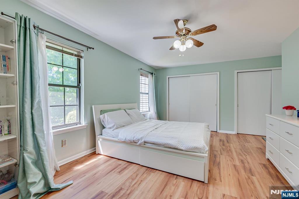 1402 Maplecrest Road, Unit 1402 Edison, NJ 08820 - Photo 25 of 37 a bedroom with a large bed and a window