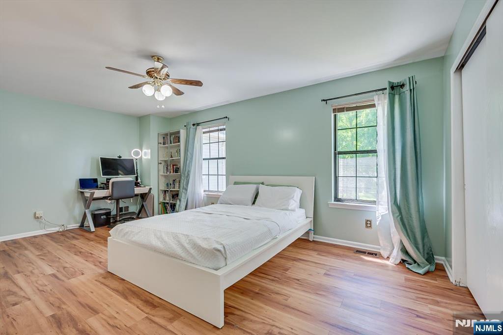 1402 Maplecrest Road, Unit 1402 Edison, NJ 08820 - Photo 26 of 37 a living room with a bed furniture and a large window